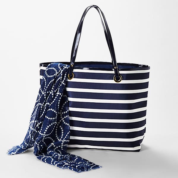 Sturdy coated poly tote bag with gold accents & pockets. Matching soft printed wrap scarf with fringe.