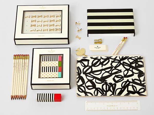 Deluxe stationery items: gold electroplated push pins; printed sturdy leatherette pencil pouch with pencils, eraser, gold sharpener and ruler; fun eraser set; bridge-style pre-sharpened pencil set; acrylic frame for your desk.