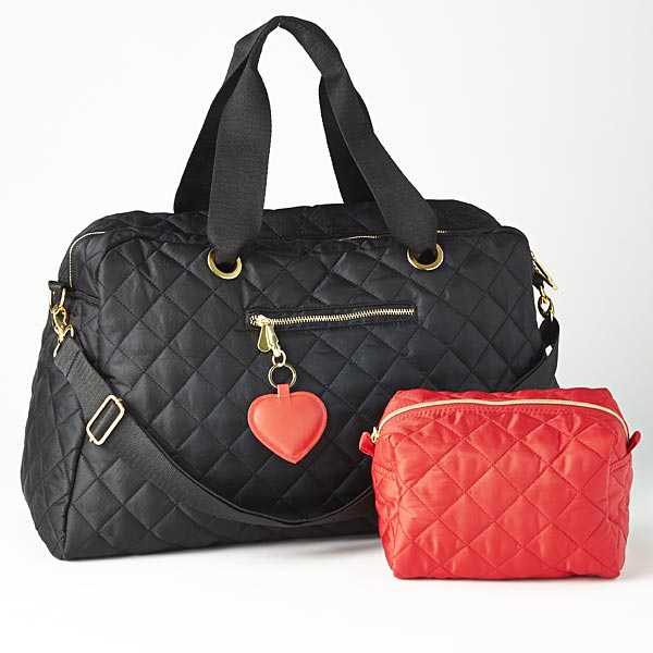 Quilted duffle with gold accents, pink lining, and zippered pockets; matching quilted cosmetic bag with interior lining; and faux leather heart key chain with gold accents.